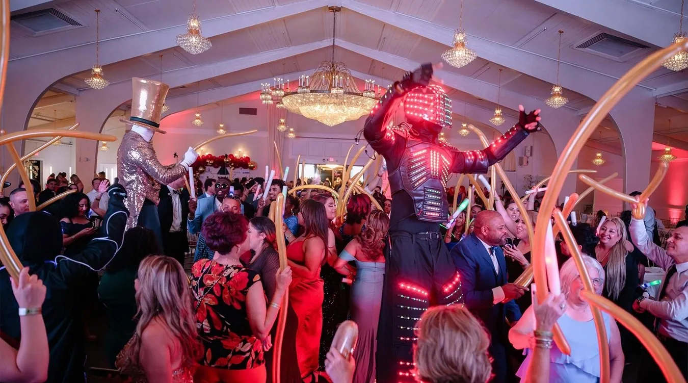 Guests on the dance floor with live performers